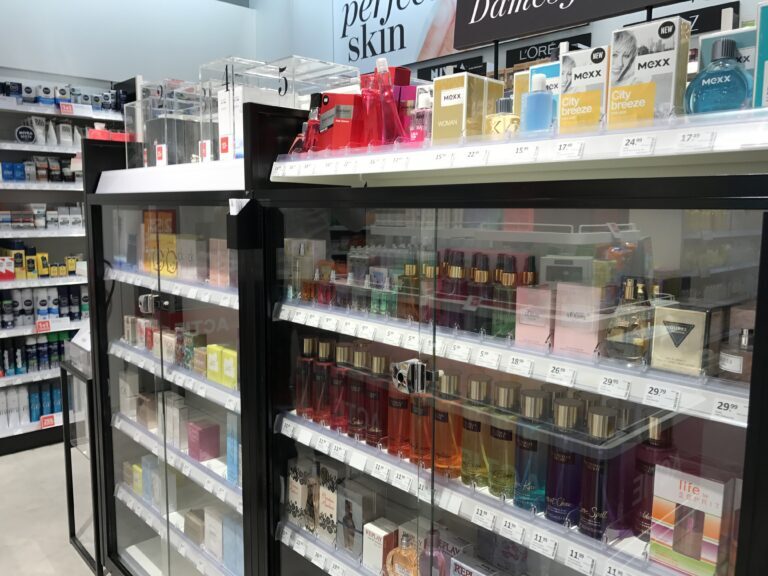 Espositore in vetro per profumi, lozioni, fragranze e altri prodotti, dotato di chiusura di sicurezza.